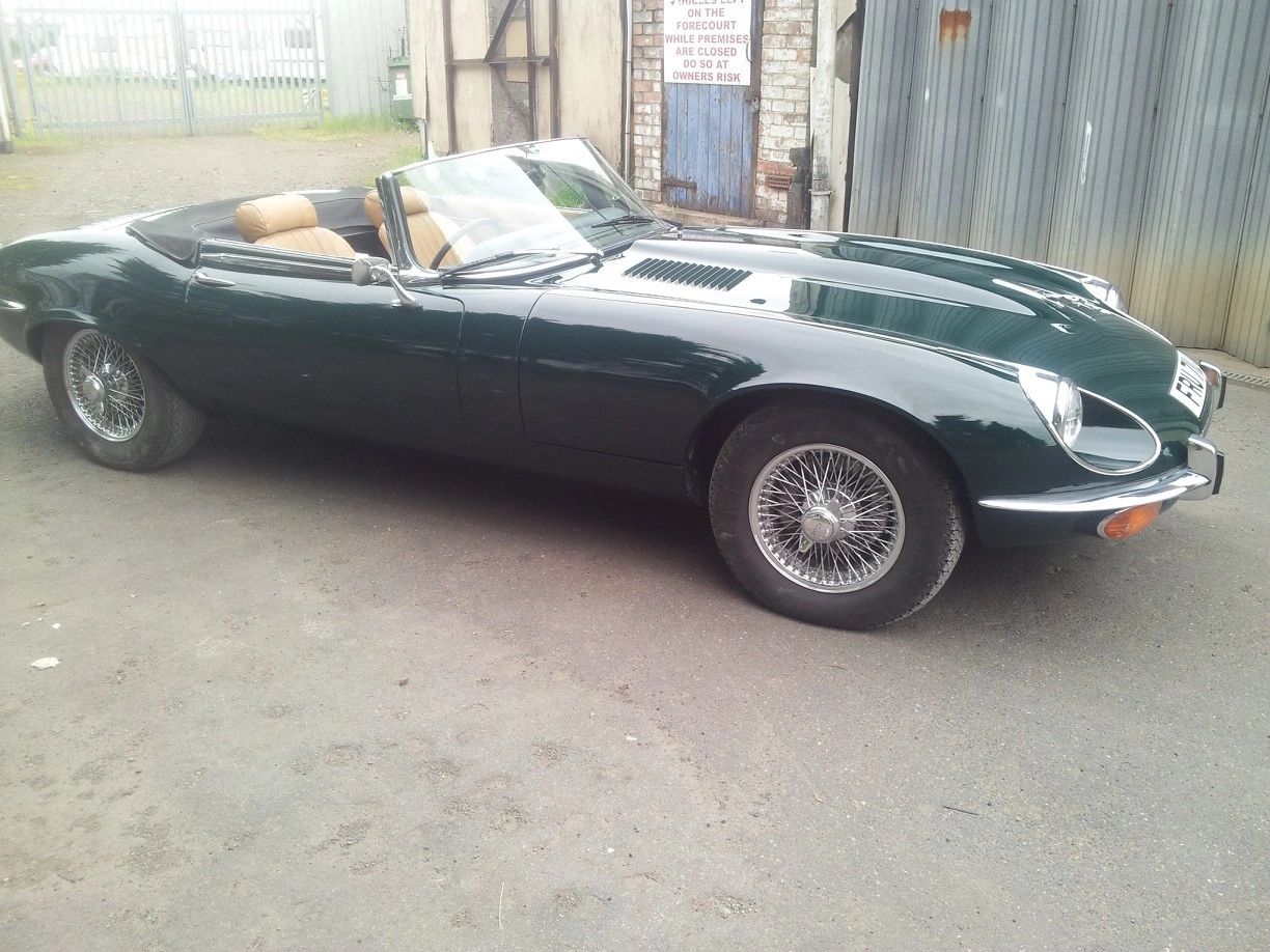Classic car body restoration in primer